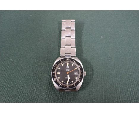 Tissot Navigator Swiss made wristwatch with stainless steel strap.