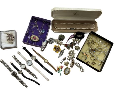 A collection of vintage costume jewellery to include novelty brooches in various forms, necklaces, earrings and fashion watch