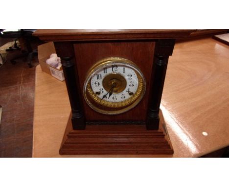 A Fattorini &amp; sons of Bradford wooden mantel clock. An enamel clock face, Pendulum included but no key. Case needs restor