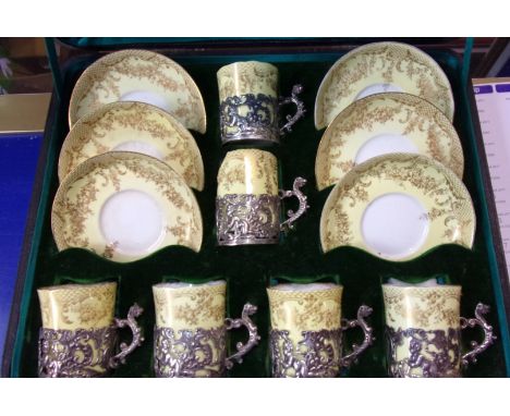A leather George Edward &amp; sons of Glasgow Case with 6x egg shell coffee cups and saucers. Each cup is held within a silve