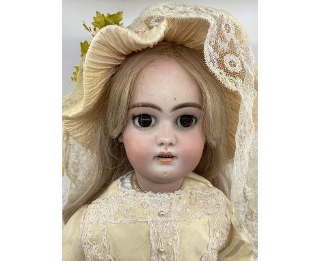Antique Simon and Halbig 1079 DEP child bisque doll &nbsp;with dark brown glass eyes, long hair wig and a tailored good cream