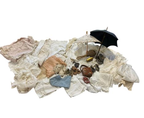 A group of vintage and antique doll's and babies' clothes to include a pink cotton cape with lace trim, a cotton flannel unde