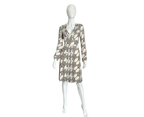 A 1970s does 40s inspired 2006 Gucci dress made from a silk jersey with stylised horse bit print in olive green and maroon on