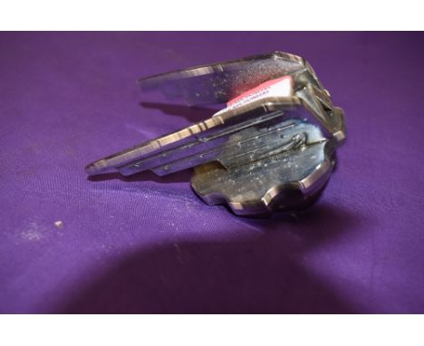 A vintage motor car engine hood badge for Wolsey