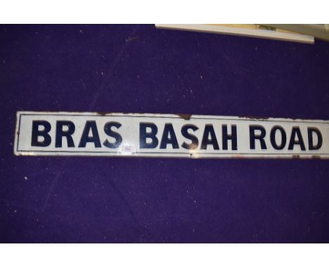A vintage road side enamel sign reading Bras Basah Road