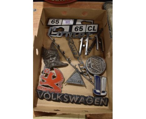 A selection of vintage garage motor car engine badges