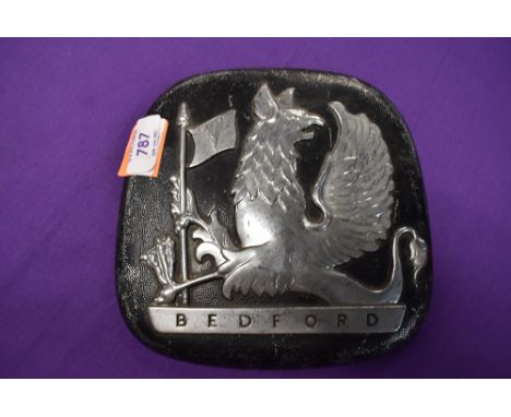 A vintage Bedford truck engine badge with gryphon emblem