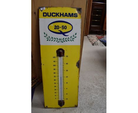 An enamel garage advertising sign thermometer for Duckhams Oil