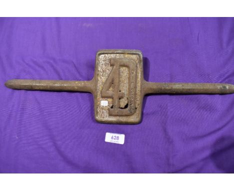 A cast metal motor car engine badge for Ford 4D
