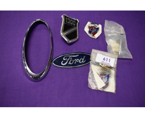 A selection of motor car engine badges for Ford Ghia