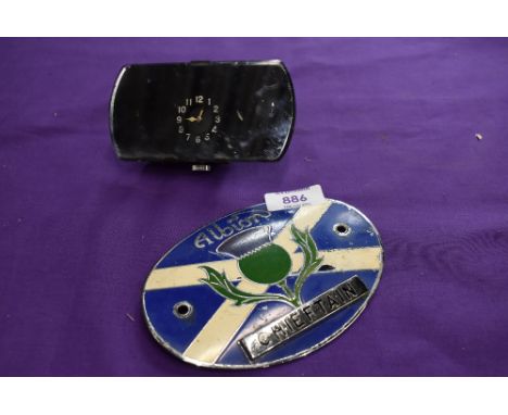 An Albion motor engine badge and a mirror back car clock