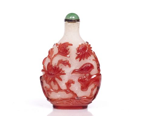 Beijing cameo glass snuff bottle Chinese, 1840-1880 of flattened pear shape decorated all over with a garden scene of rocks, 