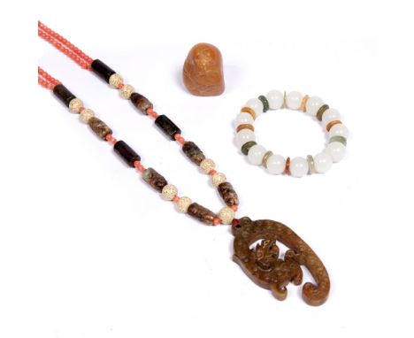 Jade and coral necklace Chinese a carved yellow jade pebble and a bracelet with coloured hardstones. (3)