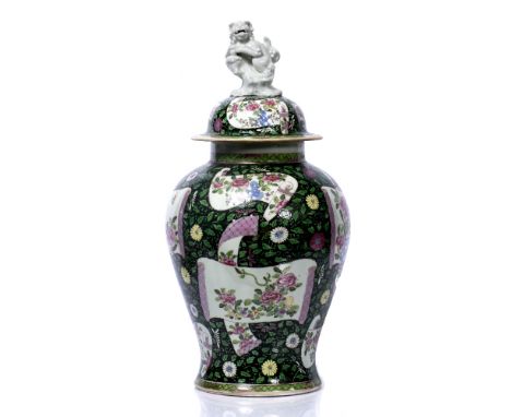 Famille rose vase and cover Chinese, 19th Century having reserve hand scroll type panels of peonies and insects, with Dog of 