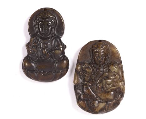 Mottled green and brown jade oval shaped pendant Chinese, 19th Century carved in relief with a seated Avalokitesvara holding 