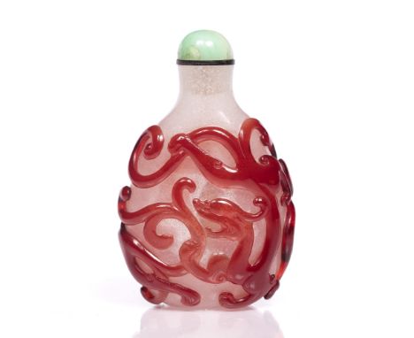 Beijing cameo glass snuff bottle Chinese, 1860-1880 of flattened pear shape decorated all over with three intertwined chi lin