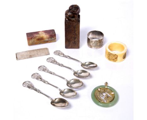 Group of pieces Chinese to include five white metal spoons, a jade and gilt metal pendant, two napkin rings and two soapstone