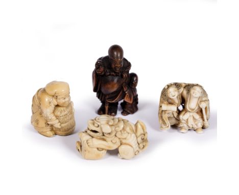 Three ivory netsuke Japanese, 18h Century a squatting shishi and rock,  Kyoto school Genii of harmony carrying broom and make