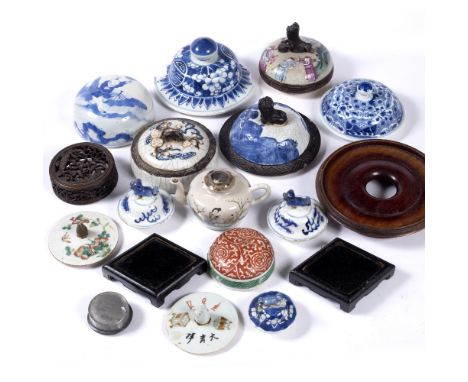 Assorted collection of lids and stands Chinese  to include various wooden stands, blue and white lids and a teapot