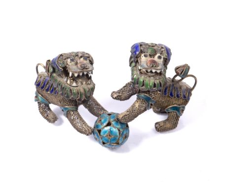 Pair of filigree and enamel miniature temple dogs Chinese, 19th Century each attached to a turquoise ball dogs 5cm across