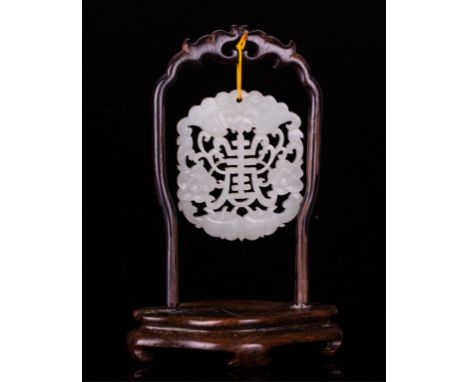 Qing dynasty, open work white jade plaque  hang on a rosewood stand; 1 3/4 by 2 1/4 in.