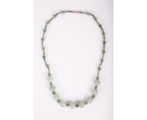 20th century; jade beads varies in size and  color, from light green to dark green; 21 5/8  in. l