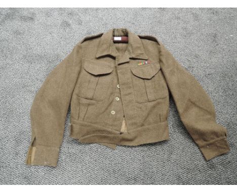 A 1940 WW2 Officers Battle Dress Blouse size number 7, made by G Glanfield &amp; Son with cloth pips to shoulders
CONDITION R