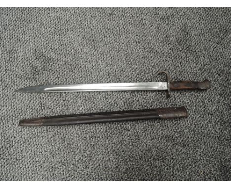 A British SMLE Bayonet pattern 1907 with metal and leather scabbard, blade marked with Crown ER 1907 209FFD and other various