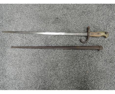 A French Gras Rifle model 1874 Bayonet in script 1879 with metal scabbard, blade length 52cm, overall length 64cm,