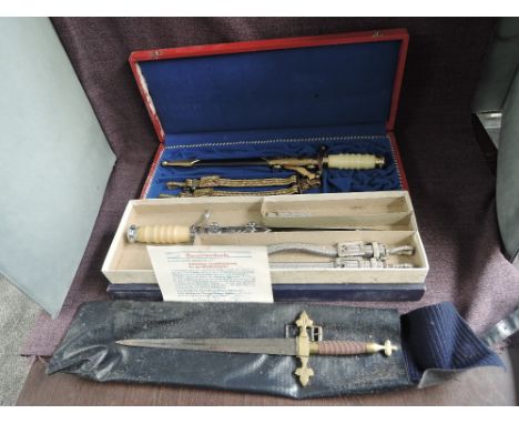 Three Masonic Daggers, two boxed and one in bag, Masonic Dagger in fitted case with scabbard and hanger no makers mark, numbe