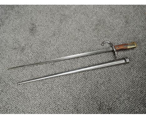 A French Gras Rifle Bayonet, model 1874 with scabbard, scabbard and blade marked 65838, blade length 52cm, overall length 64c