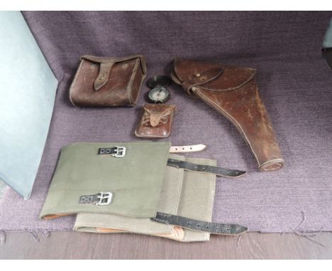 A military related collection, Leather Holster, pair of Canvas Puttees, Compass in leather case by C Baker, High Holborn, Lon
