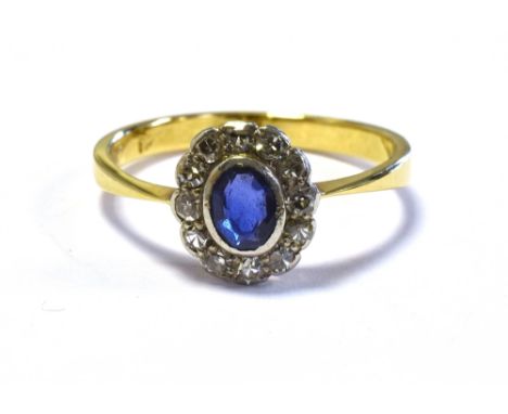 18CT GOLD SAPPHIRE &amp; DIAMOND RING 9.3 x 8.6mm oval cluster, with central bezel set oval sapphire, estimated 0.43 carats, 