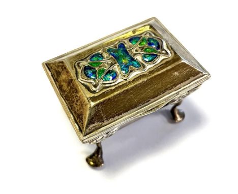 ART NOUVEAU SILVER &amp; ENAMEL TRINKET BOX Standing 4cm tall on pad feet with a hinged lid decorated in iridescent blue and 