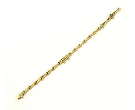 18CT GOLD RUBY &amp; DIAMOND BRACELET 18cm long x 4.2mm wide, chevron links with a centre piece of ruby and round brilliant c