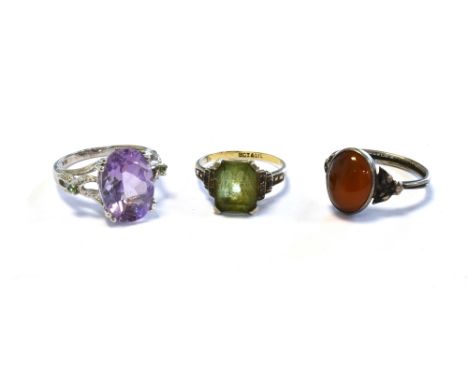 9CT GOLD &amp; SILVER GEM SET RINGS one mounted in white gold with claw set oval amethyst to centre, one silver set octagonal