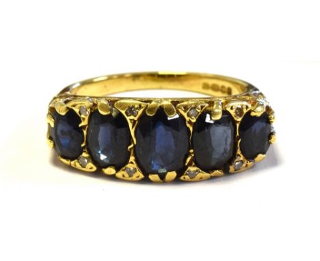 18CT GOLD SAPPHIRE &amp; DIAMOND RING Five oval claw set sapphires, of good quality, flanked by eight single cut diamonds, wi