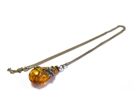 BALTIC AMBER PENDANT ON SILVER CHAIN 4.0cm long x 20.8mm wide x 14.4mm deep, pear shaped Baltic amber drop, held within a sil