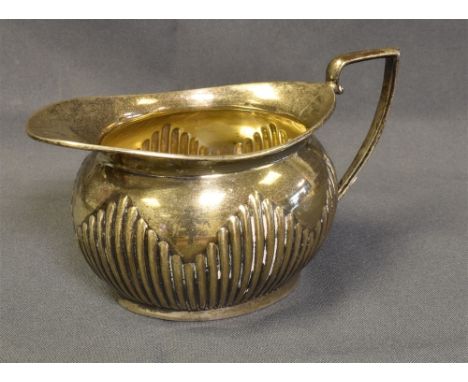 EDWARDIAN STERLING SILVER JUG Standing 6.3cm tall with embossed reeded base, hallmarked Birmingham 1901, sponsors mark B.B.  