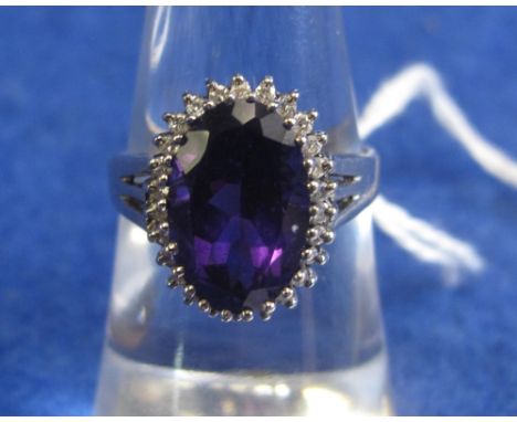 14ct white gold amethyst and diamond dress ring.(B.P. 24% incl. VAT)   CONDITION REPORT:  Ring size K 1/2.  Hallmarked 14K, 5