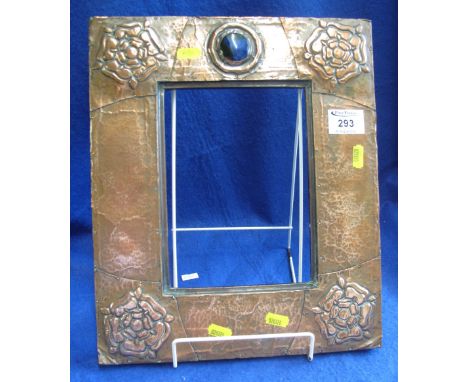 Arts and Crafts design beaten and repousse decorated copper photograph frame with cabouchon ceramic mount.(B.P. 24% incl. VAT