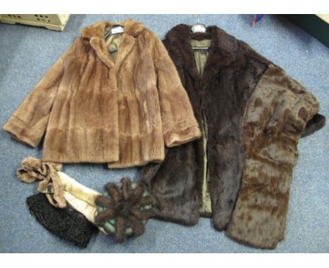 Two rabbit fur coats, a three-quarter length dark brown and a short light brown coat, together with a brown fur stole, a gree