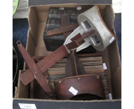 Two hand held stereoscopic viewers together with a large collection of slides, topographical, portrait groups etc., in an ope
