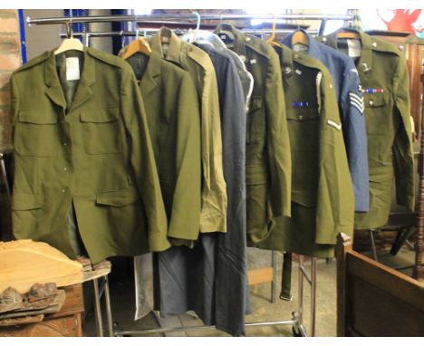 Rail of assorted military uniforms and uniform items, to include Army number 2 uniforms, Air Force number 1 dress uniform, ca