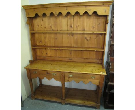 Natural pine pot board dresser with boarded two shelf rack back and two frieze drawers.(B.P. 24% incl. VAT)