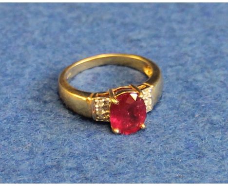 18ct gold, ruby and diamond ring, (ruby treated).(B.P. 24% incl. VAT)   CONDITION REPORT:  Size of ring - M 1/2 . Weight of r
