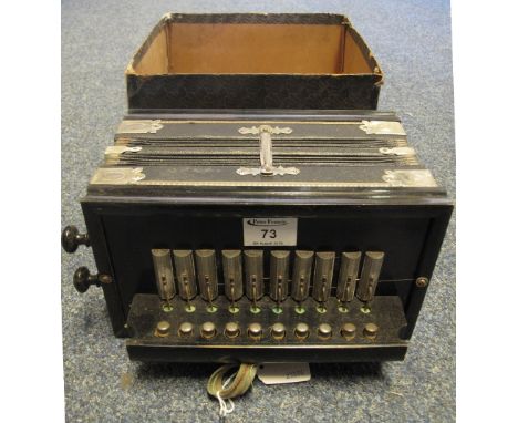 Ebonised wooden accordion in original box.(B.P. 24% incl. VAT)
