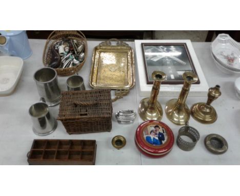 A pair of 19th Century brass candlesticks; an Eastern brass tray; a basket of cutlery; three tankards; a table lighter etc.