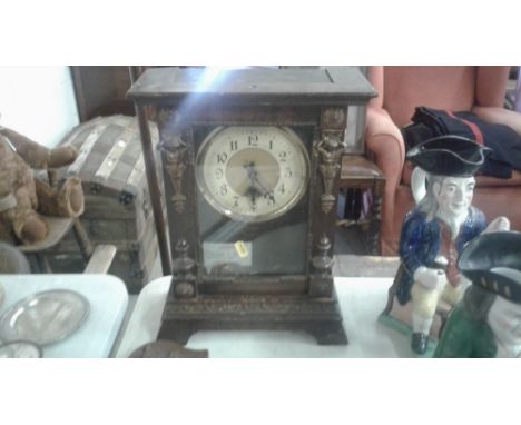 An oak barometer AF together with a late 19th Century single hole mantel clock 