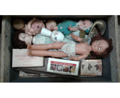 A dome topped trunk containing dolls etc. 